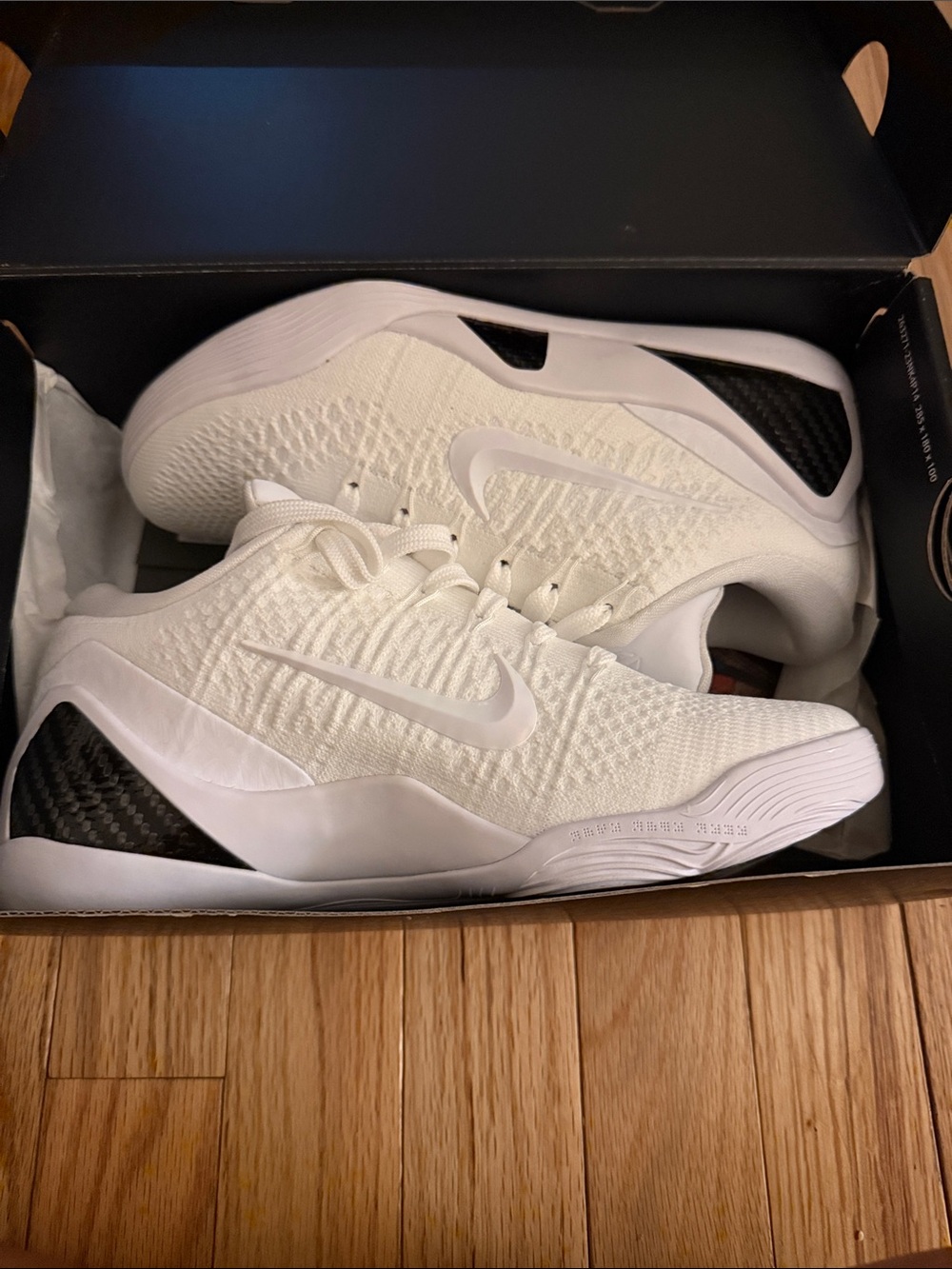 Nike Men’s White Sneakers with Black Heel Accents